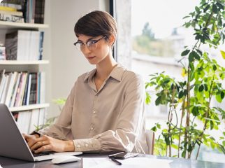 young-woman-working-on-laptop-2022-02-02-04-50-04-utc@2x